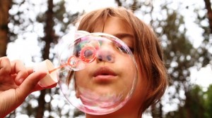 Girl blowing bubbles_child childhood cancers_oncology news australia