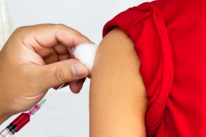 Boy getting an injection.
