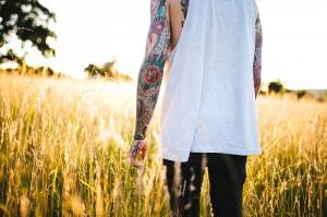 boy with tattoos outdoors tattoo sleeve_oncology news australia
