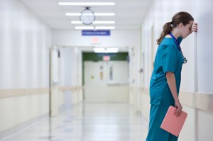 doctor hospital corridor stressed tired burnout_oncology news australia