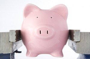Piggy bank in jaws of vice