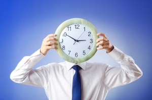 man holding clock_time concept_oncology news australia