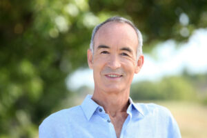 older man in countryside green_1000x667