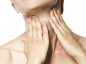 woman checking throat oncology news