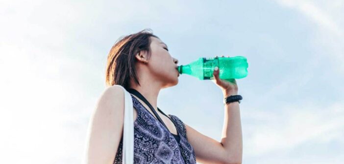 woman drinking soda sweetened fizzy drink coke sprite breast cancer risk oncology news australia
