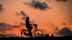 woman outdoor health wellbeing cycle sunset_oncology news australia