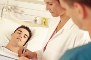young man hospital bed doctors